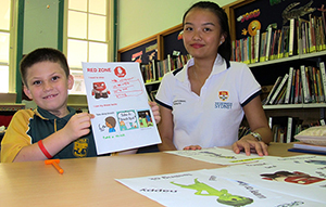 Sydney University occupational therapy student Monalisa Atmawijaya helping Kyogle Public School year 5 student Deacon Farrell.