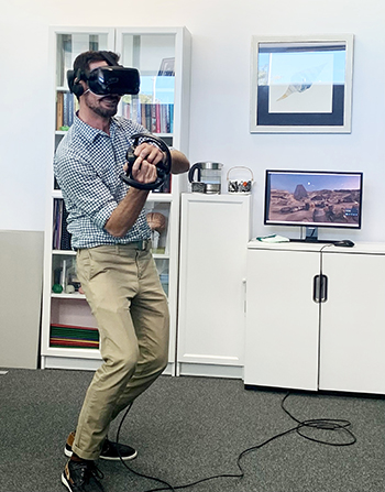 Dr Jarrad (aka Luke Skywalker) Watt, Rehabilitation Consultant, using a virtual lightsaber to fight off attacking stormtroopers and defend the millennium falcon.