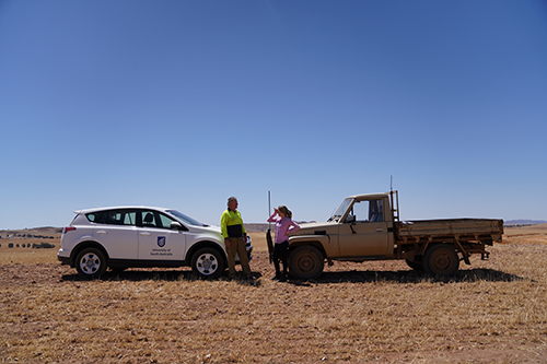 Dr Kate Gunn discussing the ifarmwell project with a farmer.